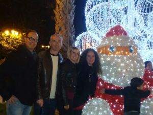 Photo of my friends and I with the illuminated Santa