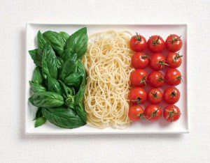 Italian flag made from basil, spaghetti and tomatoes 